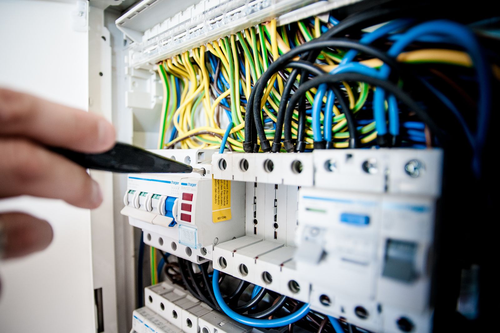Open electrical panel with breakers before an upgrade in Tacoma